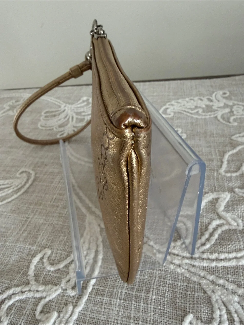 Coach Metallic Gold Wristlet with Embossed Chain Motif